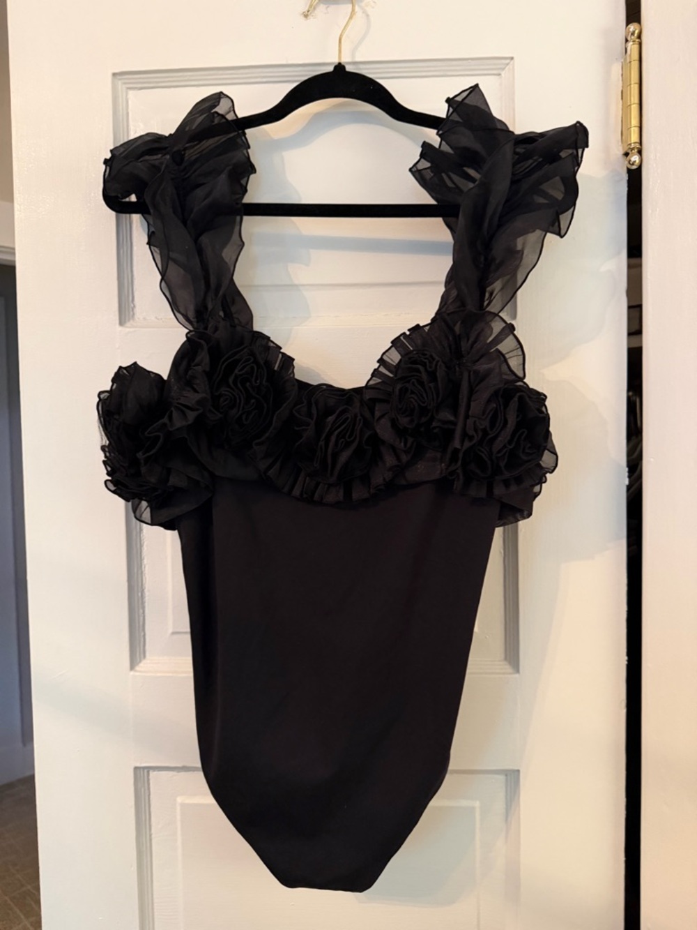 Free People black ruffle sheer strap body suit with rosettes NWOT